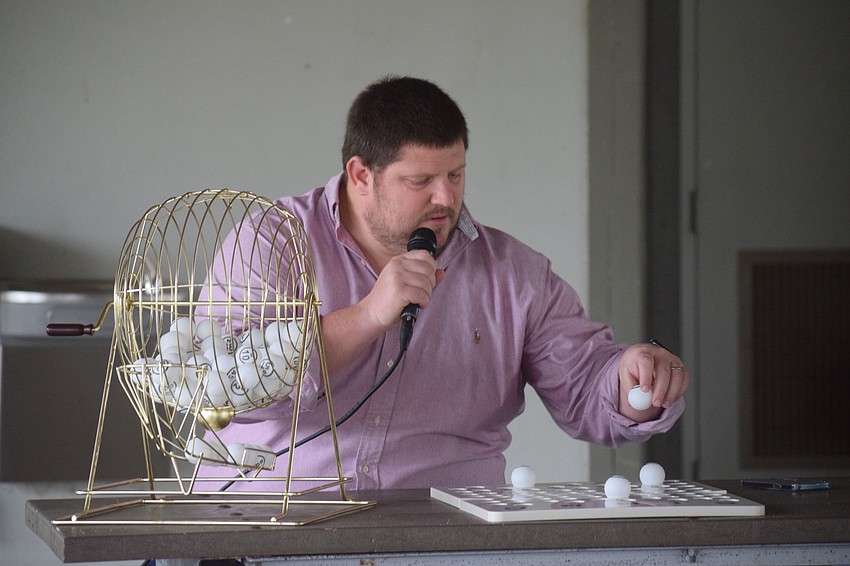 Chris McComas with Lakewood Ranch Community Activities calls out numbers.