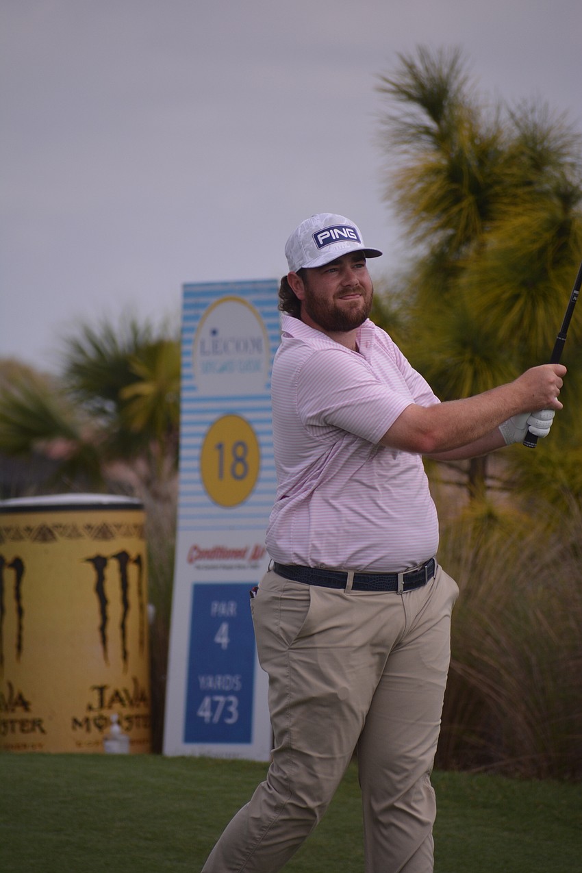 Jonathan Hardee watches his drive on the No. 18 hole sail. Hardee would bogey the hole.
