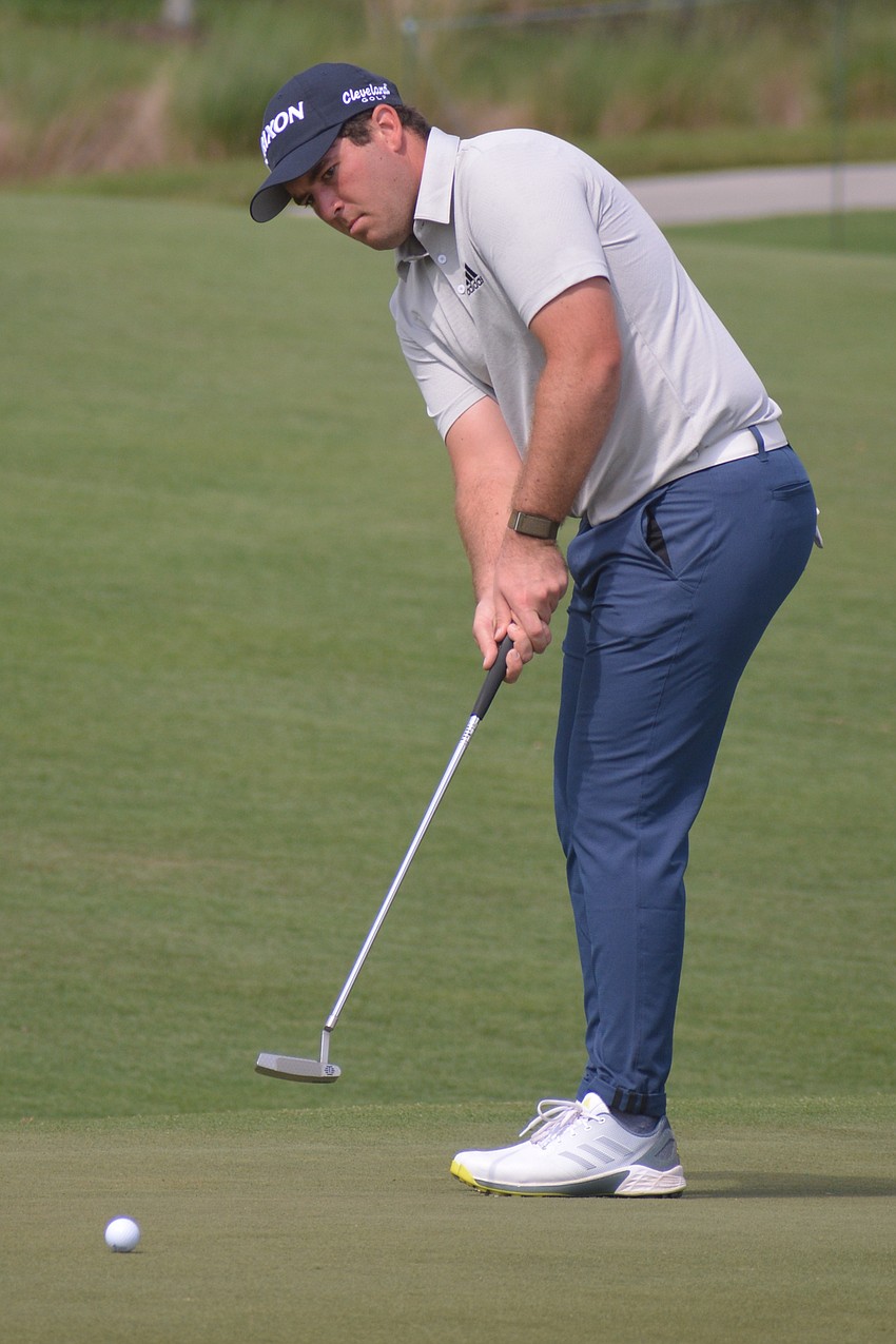 George Cunningham putts for par on the No. 18 hole at Lakewood National.