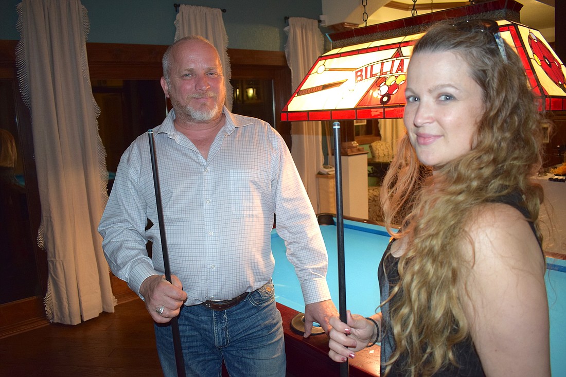 Gary Bergstrom taught Angela Horan to shoot pool even though she was using a left ventricular assist device.