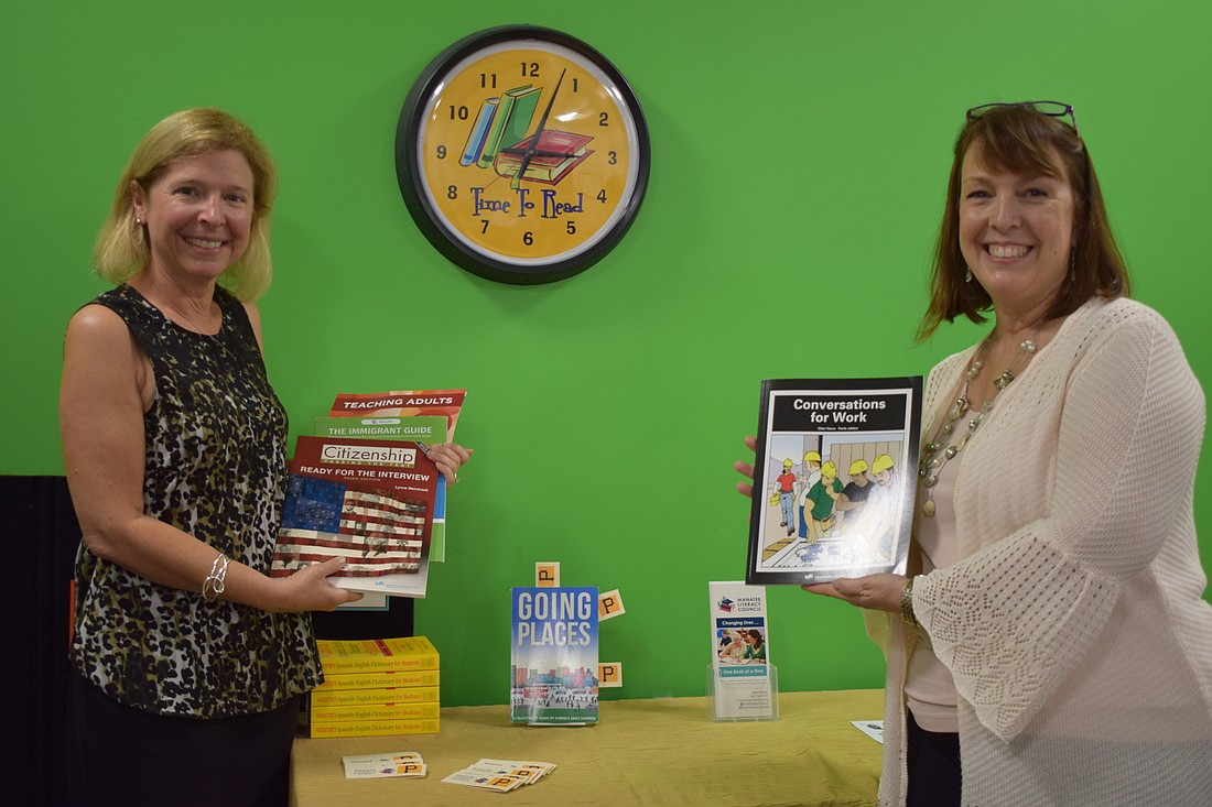 Country Club East&#39;s Jeannine Abele, who is a tutor, and Michelle Desveaux McLean, the executive director of the Manatee Literacy Council, work with learners to develop their English speaking and reading skills.