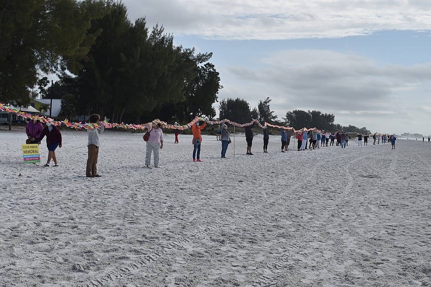 Attendees lifted ribbons to elevate the memory of lives lost.