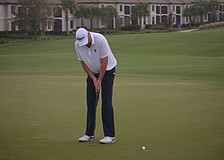 Dawie van der Walt putts for par on the No. 18 hole at Lakewood National. van der Walt was four over par on the day and even for the tournament.