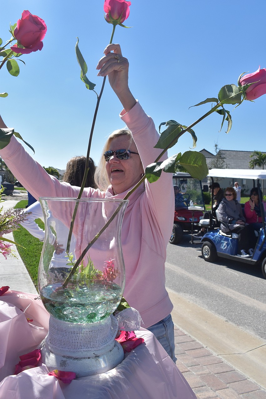 Michelle Bovis was in charge of arranging the 100 roses that were given to Rose Bauer by parade participants.