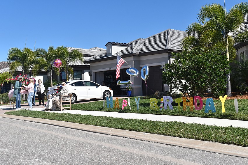 Rose and Reinhard Bauer sat in front of the Del Webb house where Rose Bauer's son, Barry Bauer, and daughter-in-law, Susan Bauer live.
