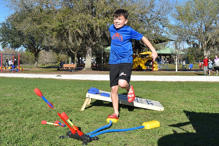 Mill Creek resident Matthew Vajanyi, 11, launches a Stomp Rocket to his friend, 12-year-old Daniel Norris.