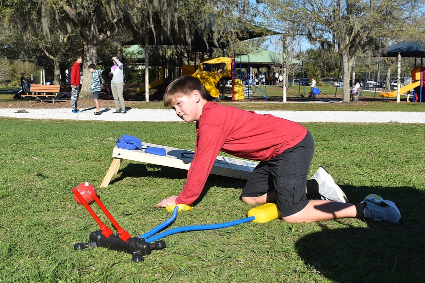 Lakewood Ranch resident Daniel Norris, 12, launches a Stomp Rocket to his friend, 11-year-old Matthew Vajanyi.