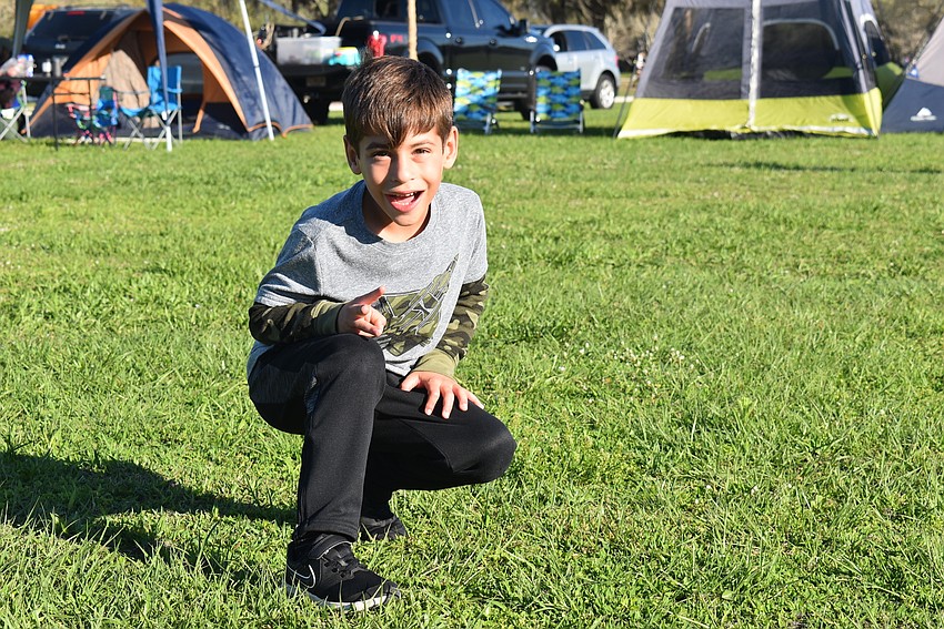 Greenbrook resident Mason Bente, 7, pauses during a game of tag. Bente was most excited about eating s'mores later.