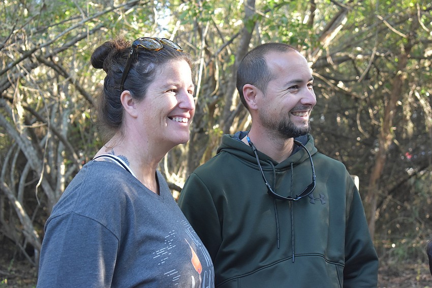 Parrish residents Tiffany and Aaron Gallegos enjoy a guided nature walk on one of Greenbrook's trails.