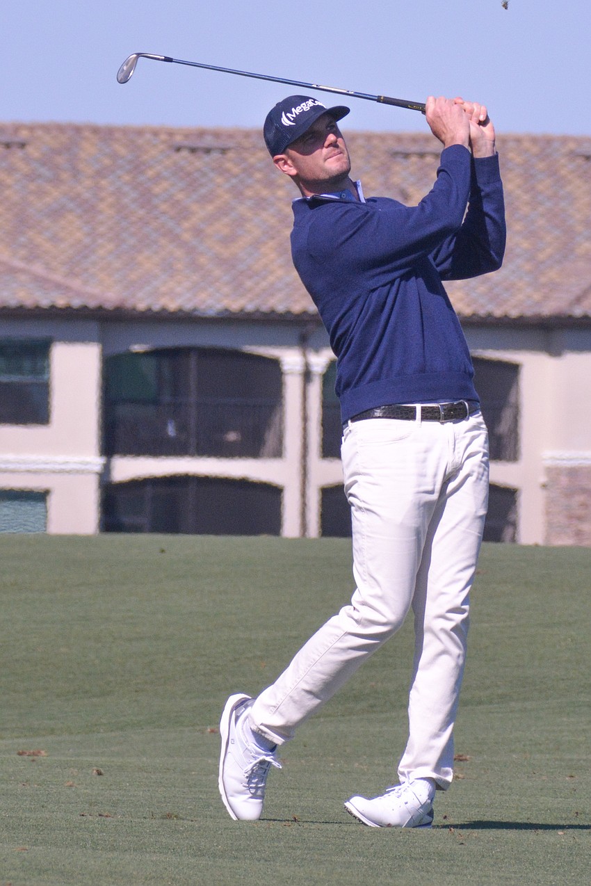 Wes Roach hits his second shot on the No. 18 hole. Roach birdied the hole, but finished the round five over par.