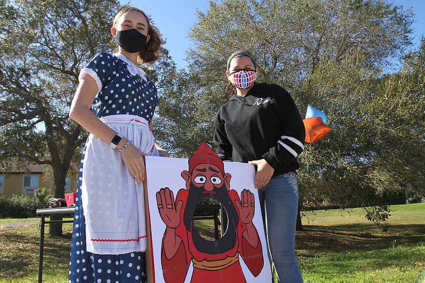 Lucy Thomas and Alix Leinweber managed the bean bag toss game.