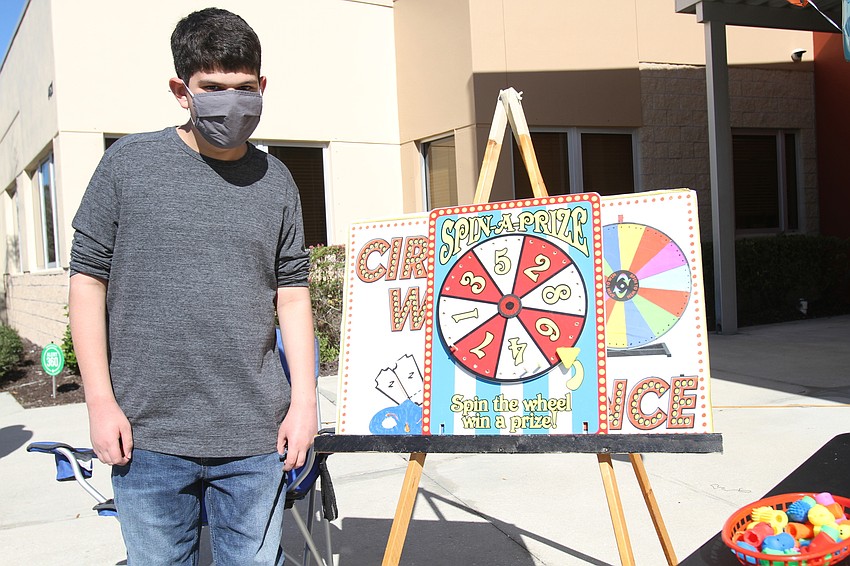 Aaron Gordon worked the spin-a-prize booth.