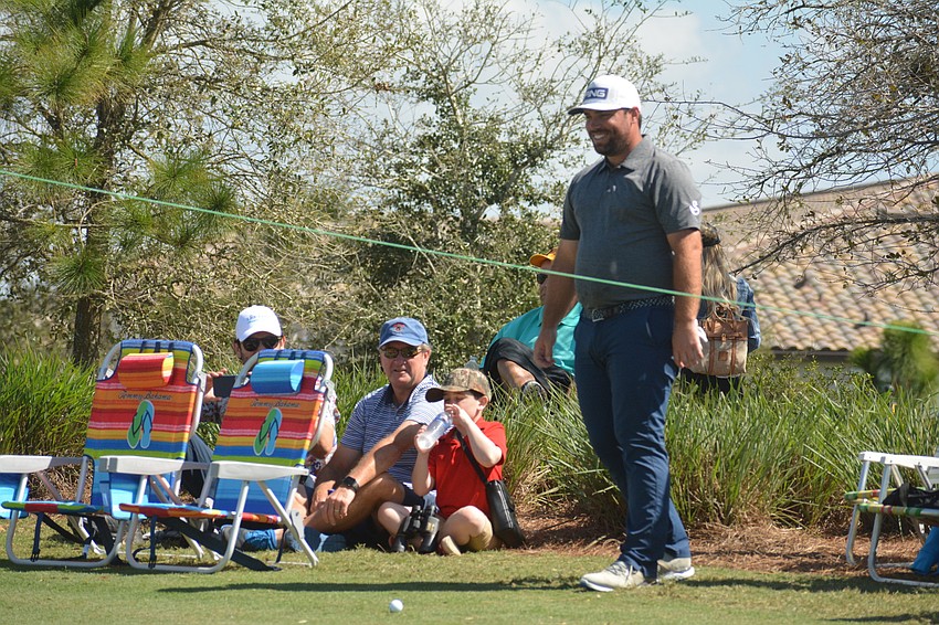 Greg Yates laughs as he plans a shot from outside the ropes on the No. 17 hole. Yates would par the hole and finish four over par on the day, two under par for the tournament.