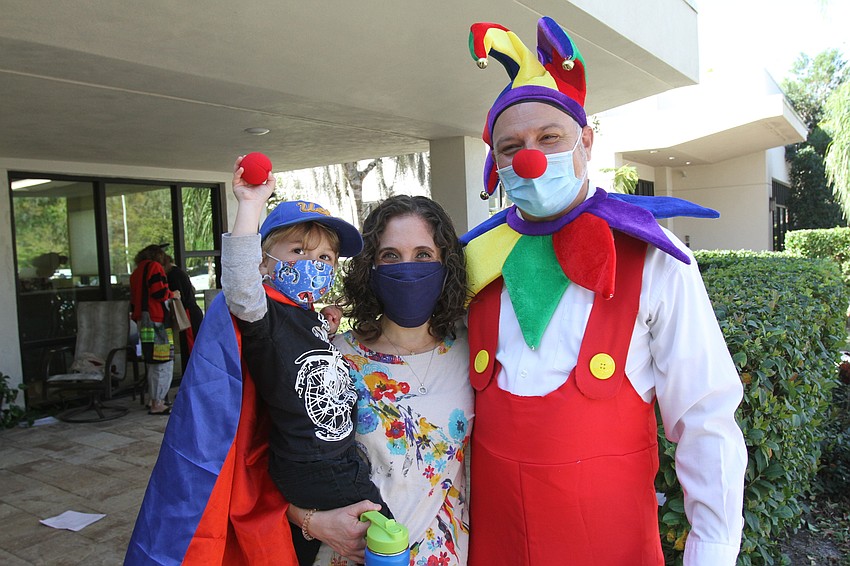 Jacob, Shayna and Rabbi Michael Shefrin dressed up colorfully for the celebration.