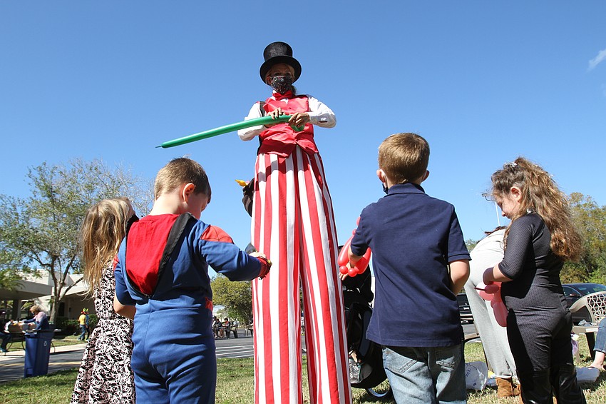 Way-Too-Tall Torri made balloon animals for kids.