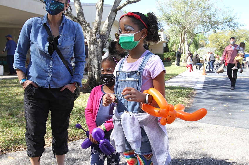 Zoe and Alie Jefferson had fun watching a clown.