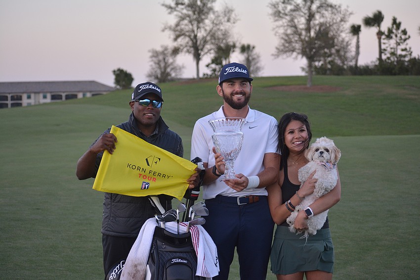 Brian Mahoney, Hayden Buckley and Feleysa Nguyen (plus Macy the dog) celebrate Buckley's win at the 2021 LECOM Suncoast Classic.