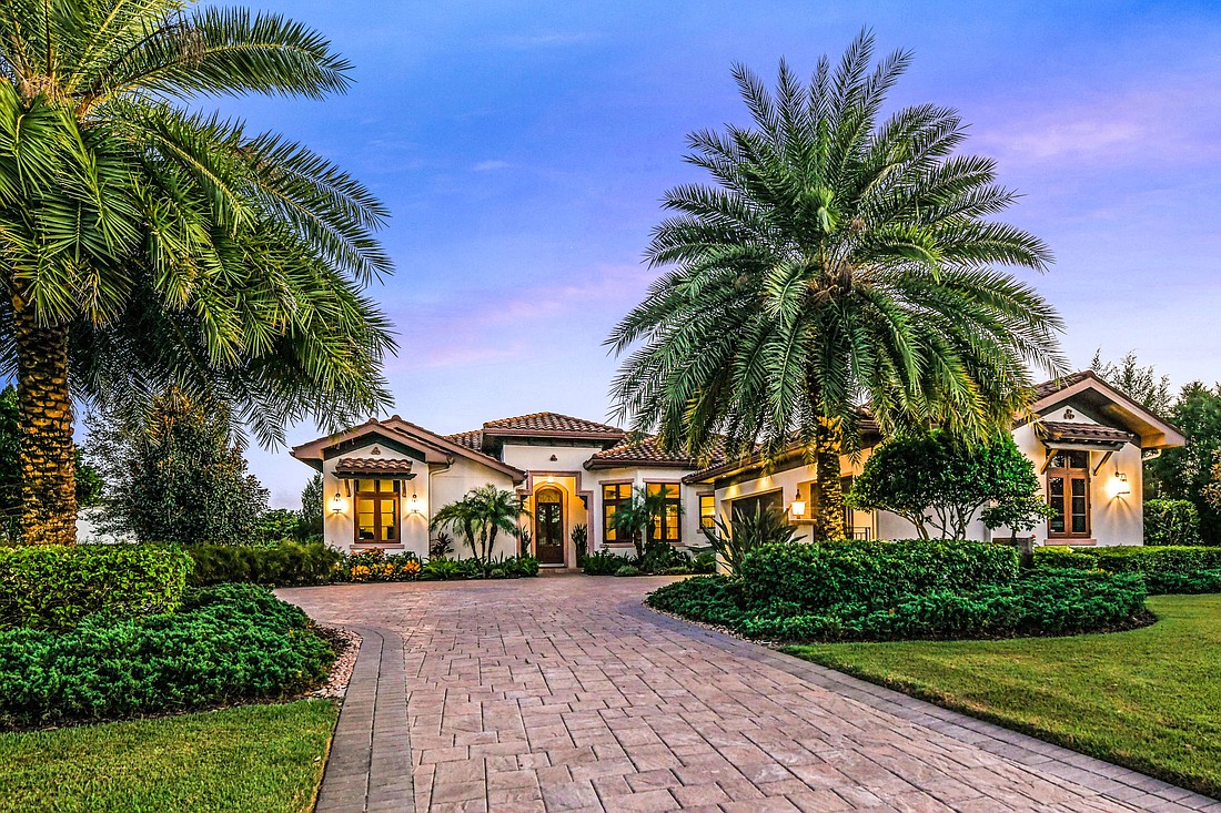 This Lake Club home at 16010 Topsail Terrace sold for $1,895,000. It has four bedrooms, four-and-two-half baths, a pool and 3,738 square feet of living area. Courtesy of Shanahan Merrill Group.
