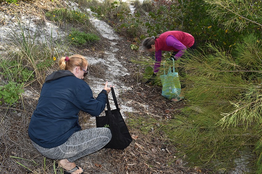 Carlyn Vigil and Cyndi Seamon found two good spots to pick up a lot of trash.