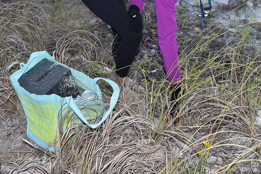 Cyndi Seamon's bag filled up on the trash pickup.