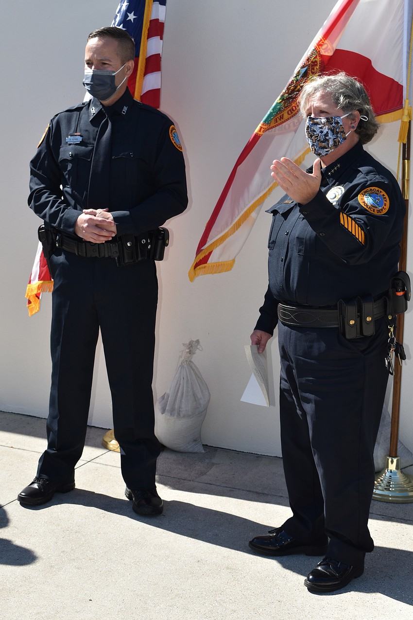 Doug Ferris (left) was sworn in as a Longboat Key police officer by Chief Kelli Smith (right).