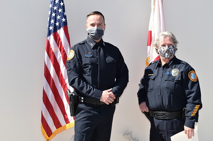 Doug Ferris (left) was sworn in as a Longboat Key police officer by Chief Kelli Smith (right).