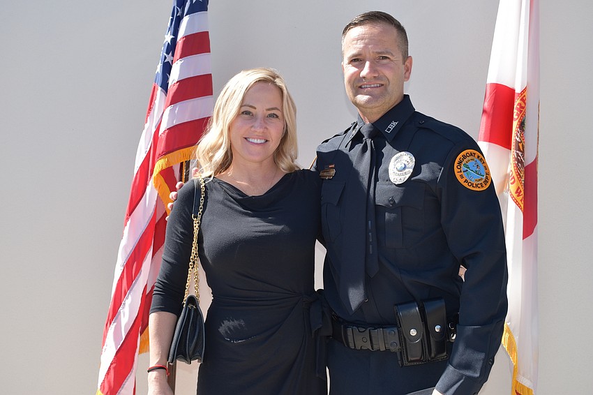 Doug Ferris (left) and his wife Kari (right) pose for a photo during Tuesday morning’s swearing-in ceremony.
