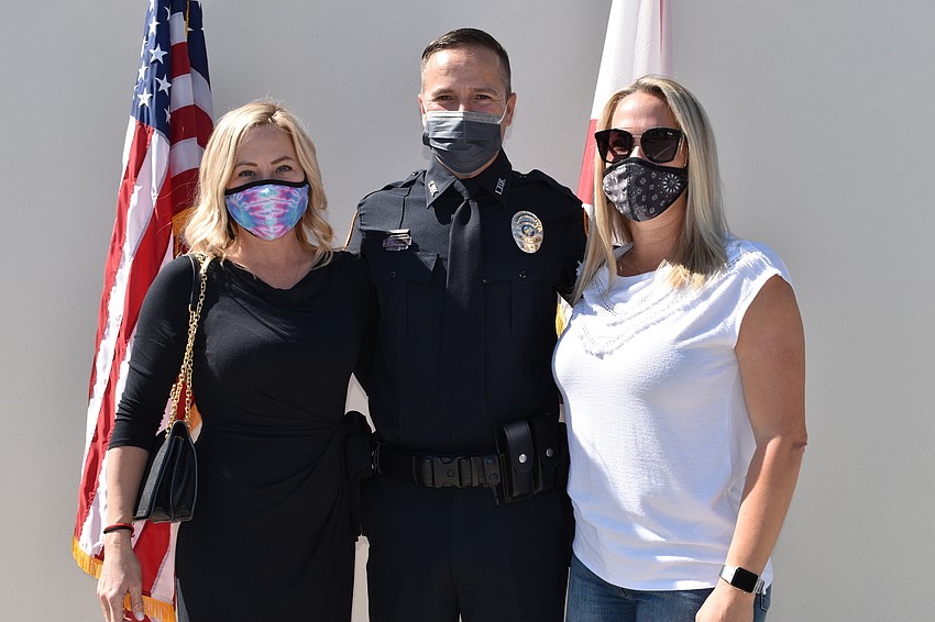 Kari Ferris (left), Doug Ferris (center) and Kelli Raines (right) pose for a photo during Tuesday morning’s swearing-in ceremony.