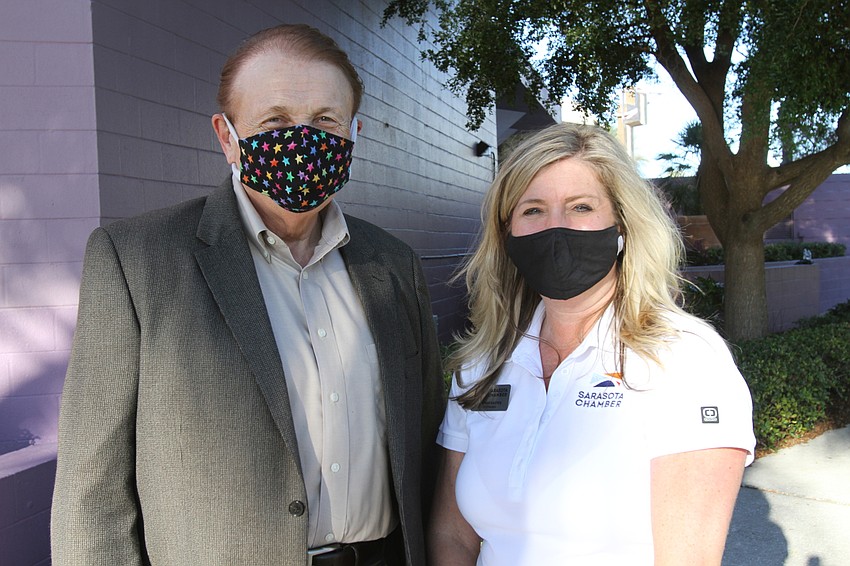 Dr. Larry Thompson and Chamber president and CEO Heather Kasten