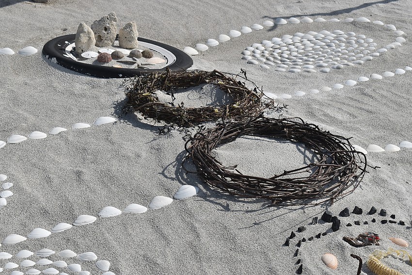 The two brown circles in the middle are wreaths that Dreyfus found washed up.
