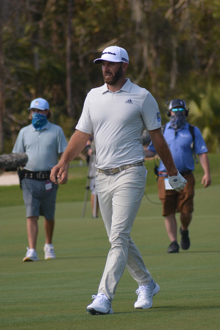 World No. 1-ranked Dustin Johnson walks to the green on hole No. 18 at The Concession Golf Club. Johnson would double bogey the hole. He finished the round five over par.