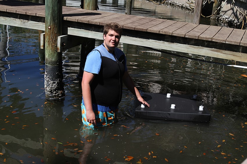 David Wolff Jr. placed a mini reef beneath the dock.