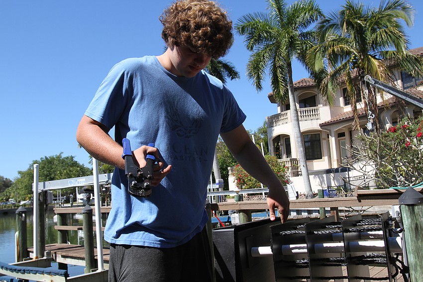 Alex Wolff set up a mini reef to be dropped in the water.