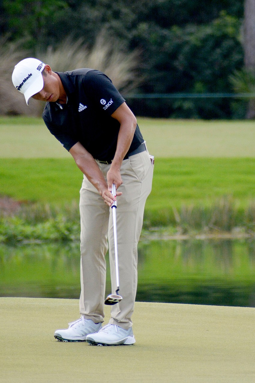 Collin Morikawa sinks a birdie putt on the No. 18 hole at The Concession Golf Club. Morikawa shot eight under par for the round and is 10 under par overall (T2).