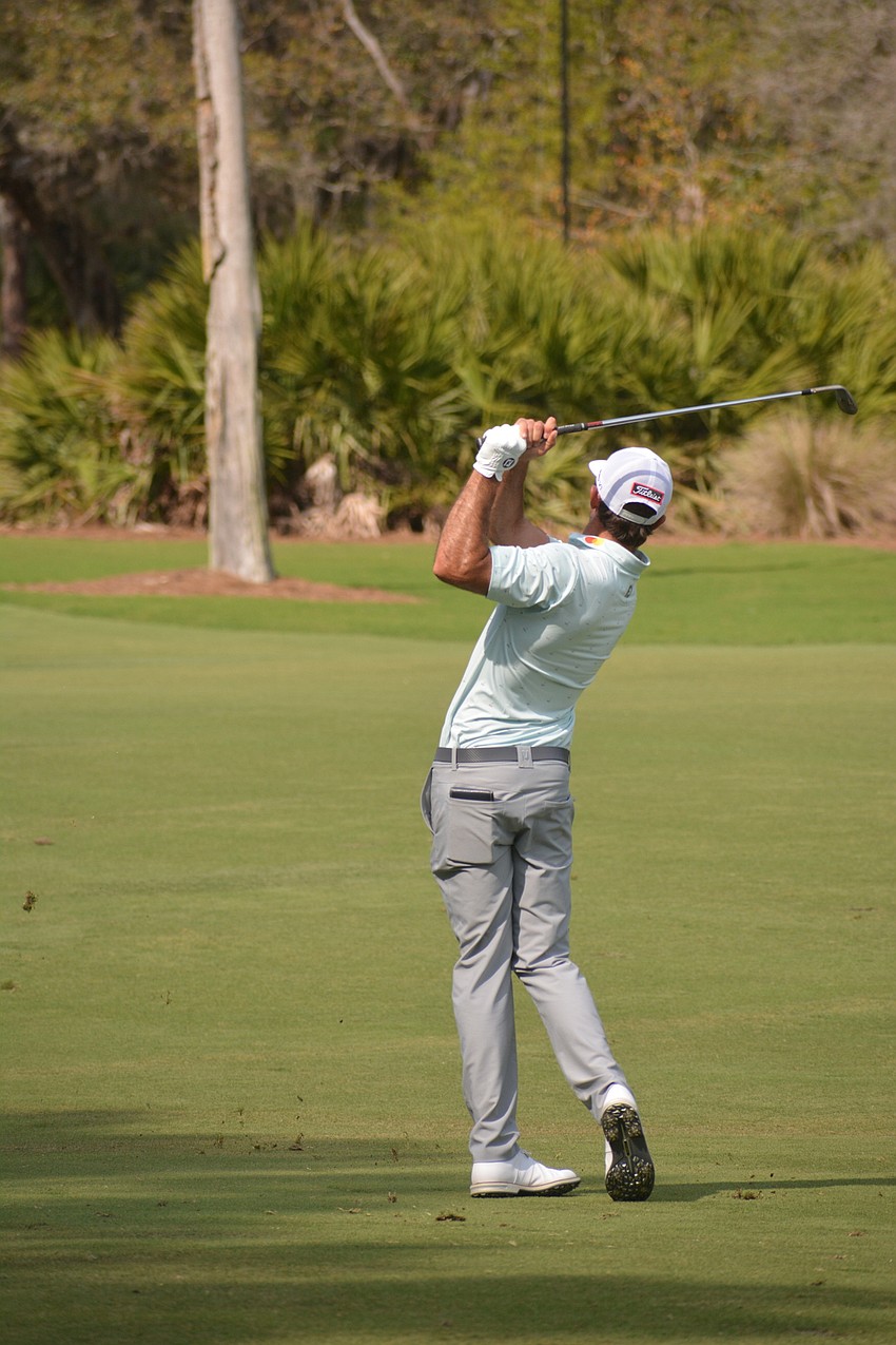 Max Homa hits his approach on the No. 8 hole at The Concession Golf Club. Homa would par the hole. He shot two under par for the round and is one under par overall.