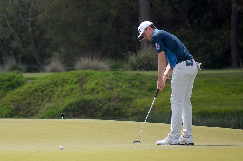 Mackenzie Hughes putts for par on the No. 18 hole at The Concession Golf Club. Hughes would shoot one over par for the round and is two over par overall.