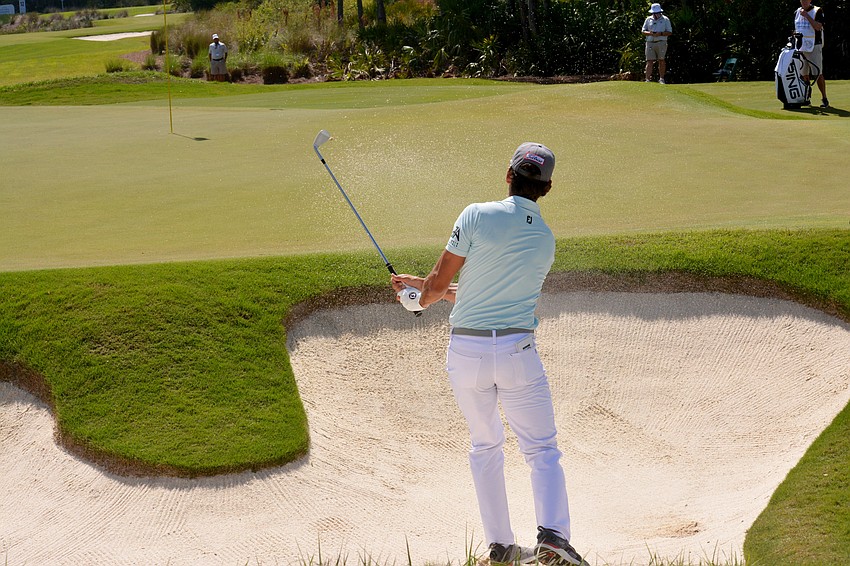 Rafa Cabrera Bello hits out of a bunker on the No. 12 hole at The Concession Golf Club. Bello would double bogey the hole. He finished one over par on the round and is three over par overall.