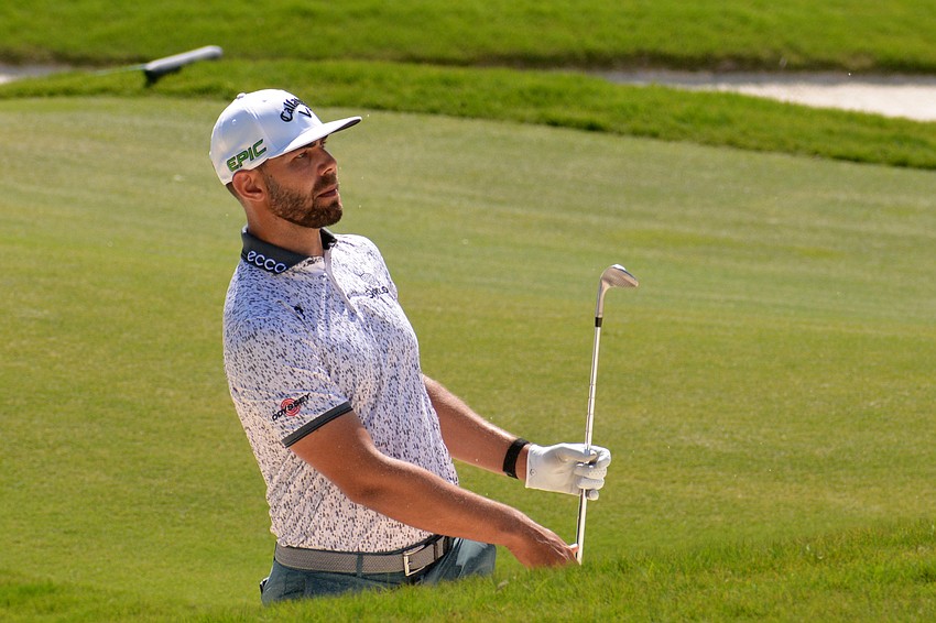 Erik van Rooyen considers his chip shot on the No. 12 hole at The Concession Golf Club. van Rooyen would birdie the hole. He shot three over par for the round and is two over par overall.