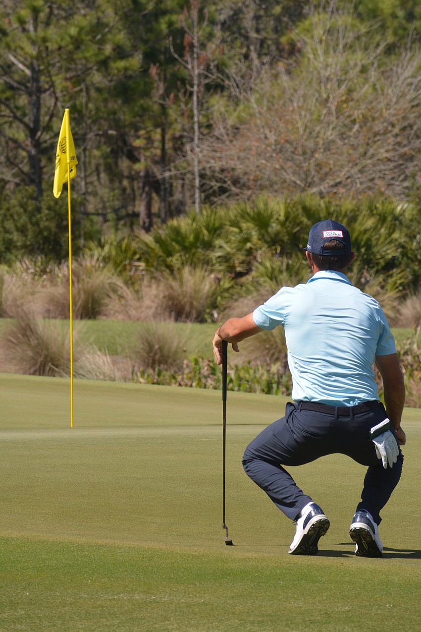 Wade Ormsby examines his putting circumstances on the No. 11 hole at The Concession Golf Club. Ormsby would par the hole. He shot two over par for the round but is two under par overall.