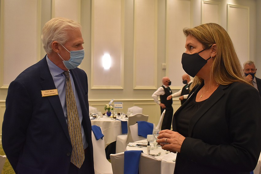 Esposito Law Group Business Development Director Virgil Mills and Florida Southern Roofing Business Development Director Cindi Bass. Mills said his favorite part of networking events is passing on knowledge to others.