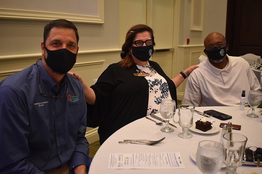 Rob Wenzel, who works for the Manatee County Building and Development Services Department as a planning manager, is pictured with Manatee County Commissioners Misty Servia and Reggie Bellamy.