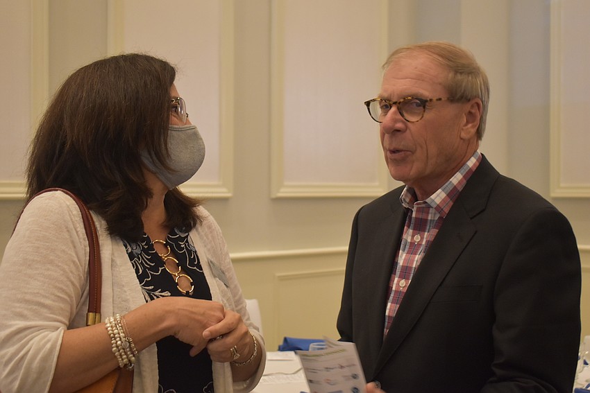 East County Observer Associate Publisher Lori Ruth is congratulated by LECOM Consultant Jim Schaffner after receiving the 2020 Chairman's Award. Schaffner said he and Ruth are close friends.