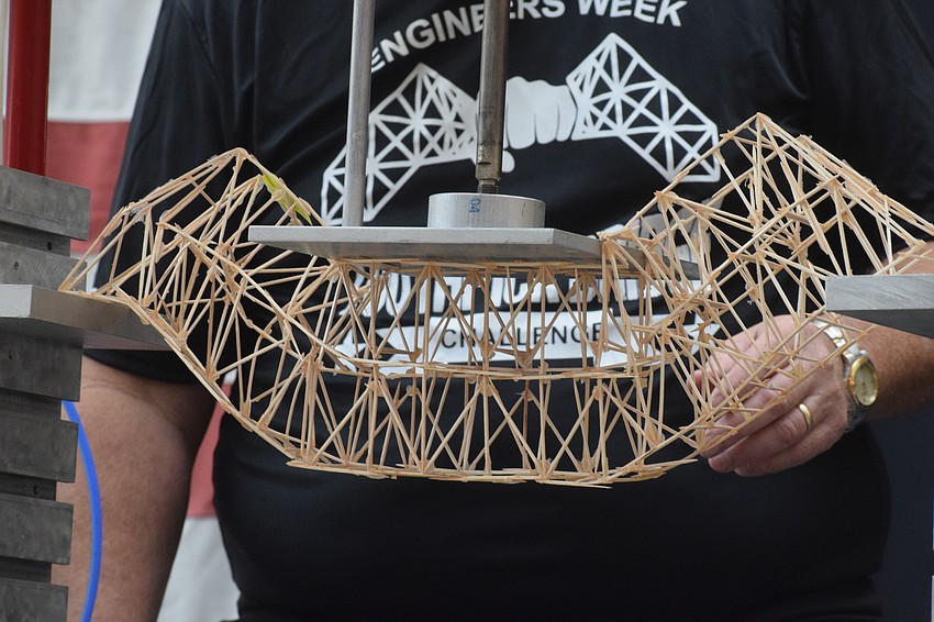 A bridge cracks under the pressure.