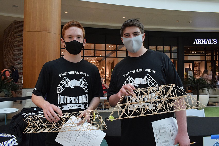 Matthew Wiley and Jayden Raymond, freshmen at Suncoast Polytechnical High School, love seeing how different bridges do under pressure.