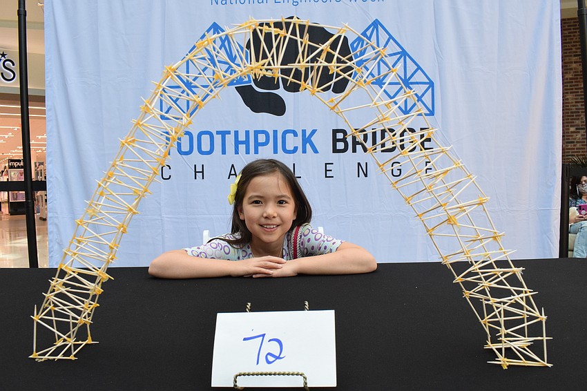 Bradenton's Amanda Hakes, who is 7, can't wait to see how many pounds her arch bridge will hold. This year's challenge was her first.
