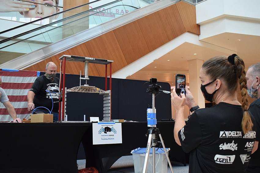 Staci LaPorte, a math teacher at Suncoast Polytechnical High School, got in on the fun and entered her own bridge into the contest. Her bridge started crushing just under 15 pounds of pressure.