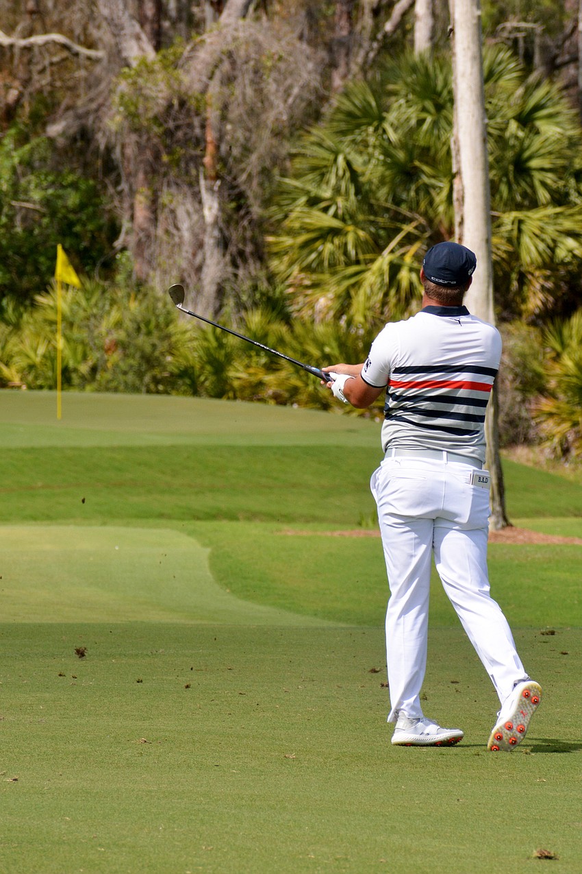 Bryson DeChambeau his his second shot on the No.  8 hole at The Concession Golf Club. He would double bogey the hole.