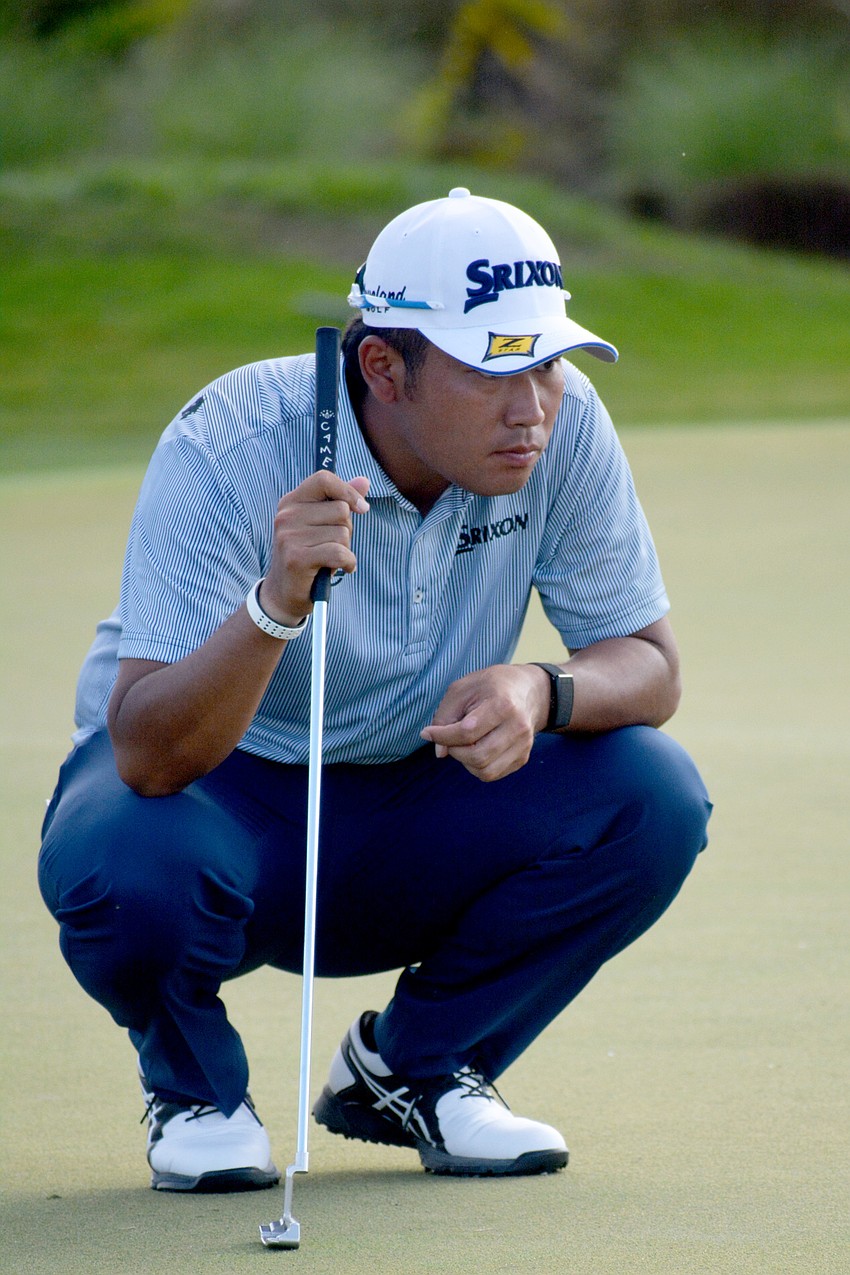 Hideki Matsuyama thinks about his putt on the No. 12 hole at The Concession Golf Club.