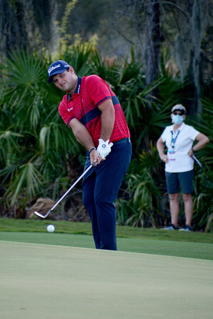 Patrick Reed chips onto the green of the No. 12 hole at The Concession Golf Club. Reed would birdie the hole.