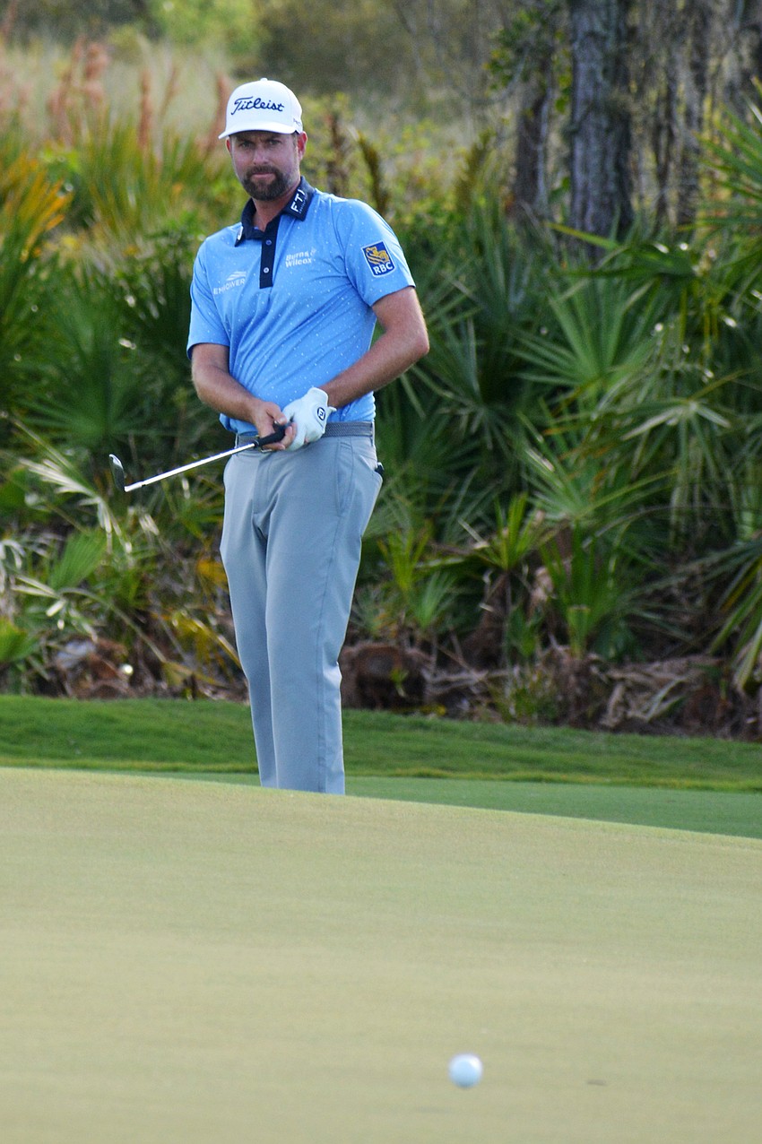 Webb Simpson watches his putt on the green of the No. 12 hole at The Concession Golf Club. Simpson would par the hole. He shot three under par for the round and is 12 under par overall (4).